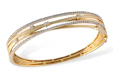 a gold bangle with diamond stones